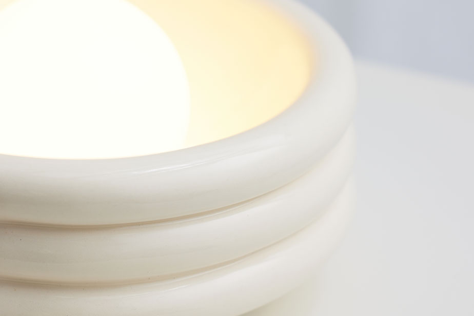 Closeup of a Silo table lamp with a gloss white glaze